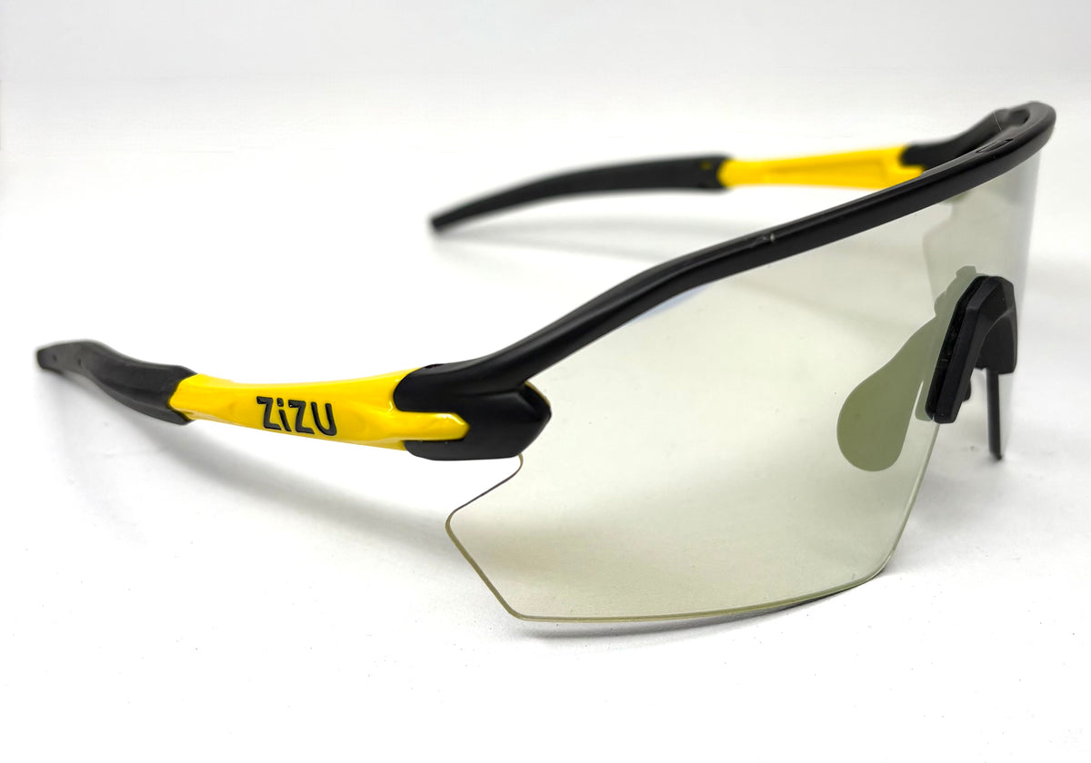 Sunglasses with black and yellow frame on a white background